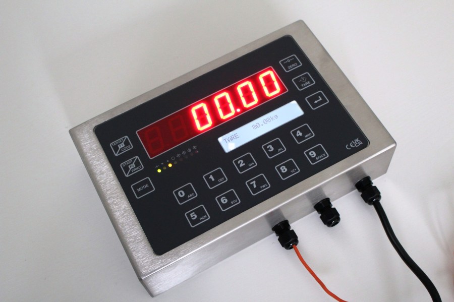 EXCELSIOR digital weigh terminal from above and to one side, with the red LED display, LCD and full keypad