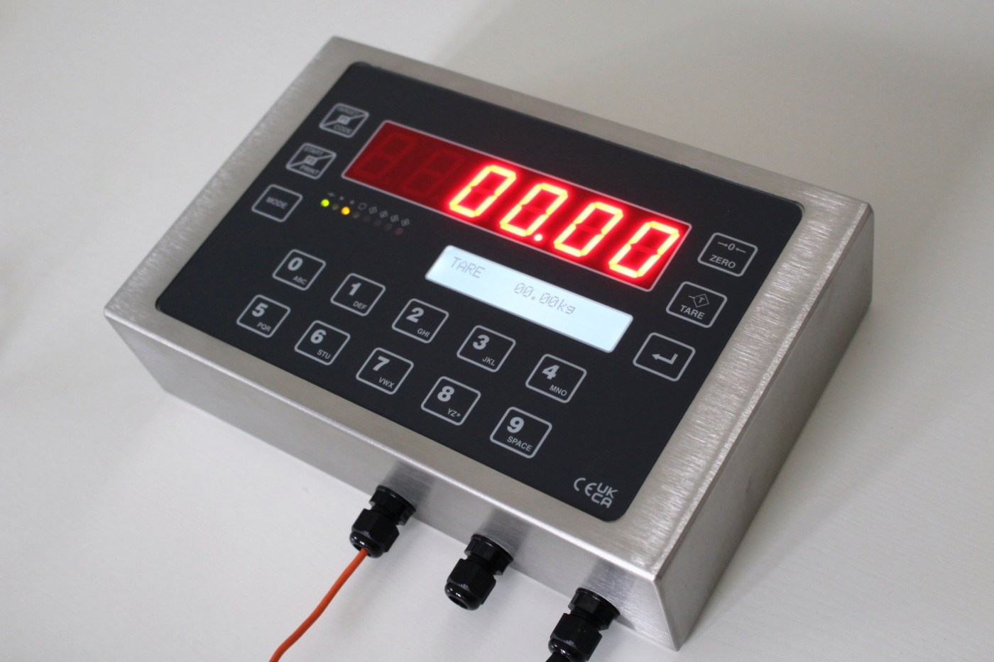 EXCELSIOR digital weigh terminal in a stainless steel enclosure, angled view showing the red LED display, LCD, keypad and cable glands