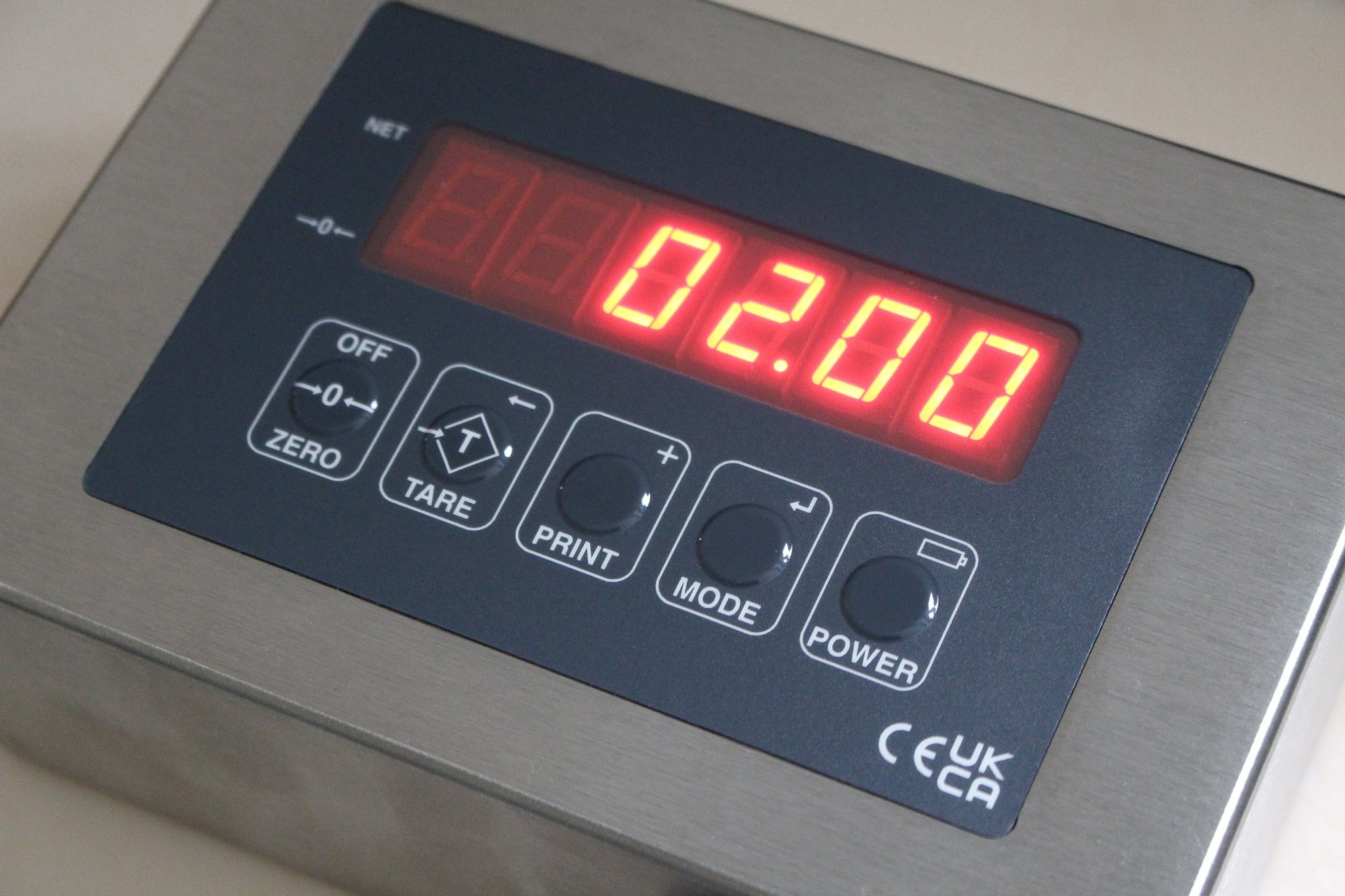 Close-up of the JUNIOR keypad with Zero, Tare, Print, Mode and Power keys